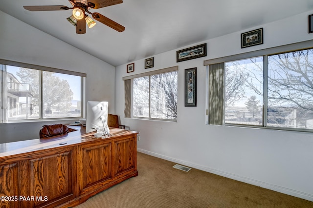 carpeted office with ceiling fan and vaulted ceiling