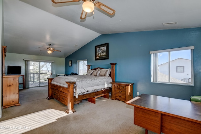 bedroom with access to exterior, light colored carpet, vaulted ceiling, and ceiling fan