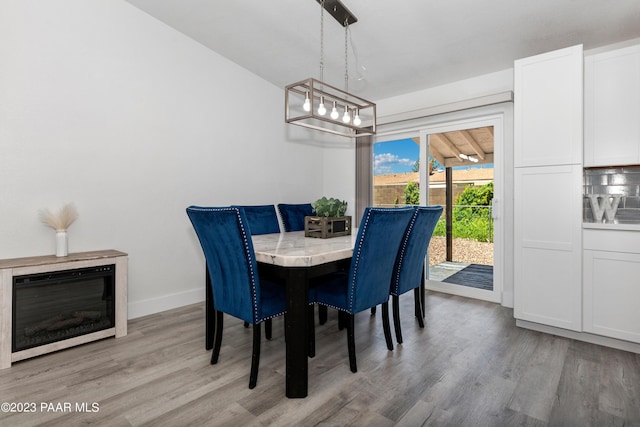 dining area with light wood-type flooring