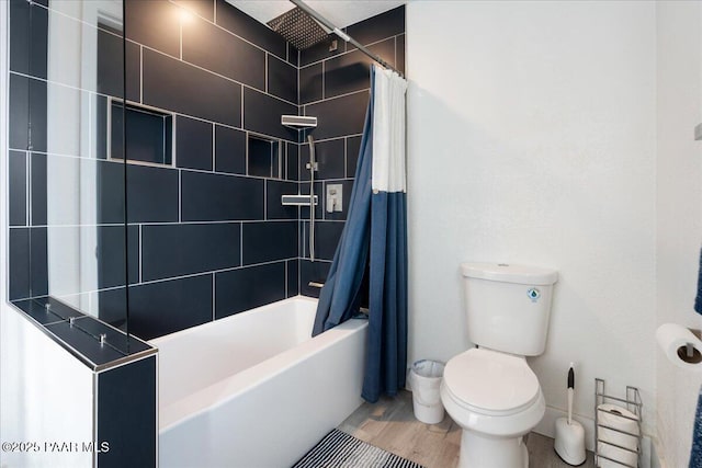 bathroom with wood-type flooring, shower / bath combo, and toilet