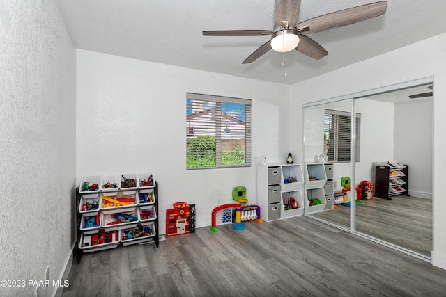 game room featuring hardwood / wood-style flooring and ceiling fan