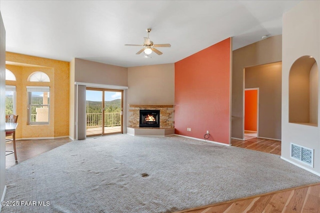 1330 Solar Heights Dr, Prescott, AZ 86303 - unfurnished living room featuring a ceiling fan, baseboards, a fireplace, wood finished floors, and lofted ceiling