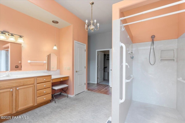 1330 Solar Heights Dr, Prescott, AZ 86303 - bathroom with a walk in shower, vanity, a chandelier, and baseboards