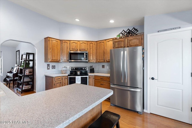 1536 Hawkeye Ridge Ave, Prescott, AZ 86301 - kitchen featuring appliances with stainless steel finishes, brown cabinets, light countertops, and recessed lighting