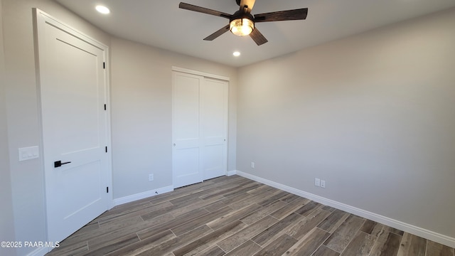 12880 E Brody Trl, Dewey-Humboldt, AZ 86327 - unfurnished bedroom featuring dark wood-style flooring, baseboards, recessed lighting, ceiling fan, and a closet