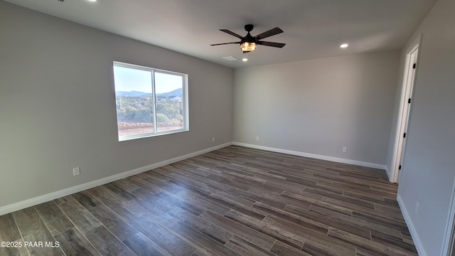 12880 E Brody Trl, Dewey-Humboldt, AZ 86327 - empty room with dark wood finished floors, a ceiling fan, recessed lighting, and baseboards