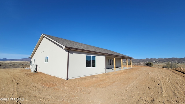 12880 E Brody Trl, Dewey-Humboldt, AZ 86327 - rear view of property featuring a mountain view and stucco siding