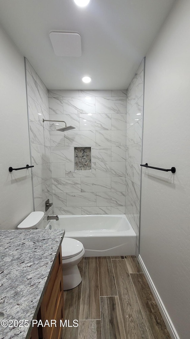 12880 E Brody Trl, Dewey-Humboldt, AZ 86327 - full bath with toilet, wood finished floors, vanity, shower / bath combination, and baseboards