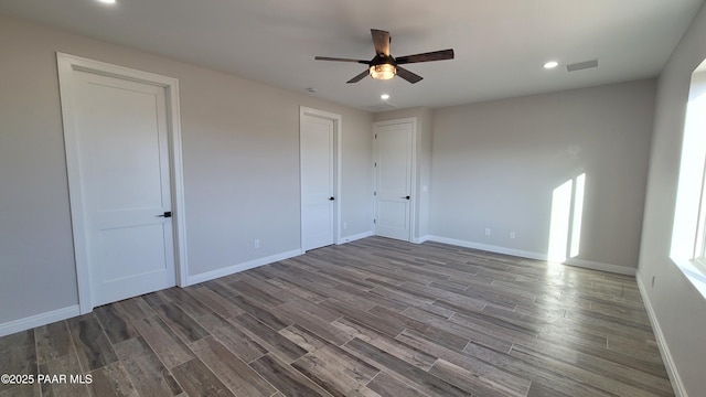 12880 E Brody Trl, Dewey-Humboldt, AZ 86327 - unfurnished bedroom featuring wood finished floors, baseboards, recessed lighting, and ceiling fan