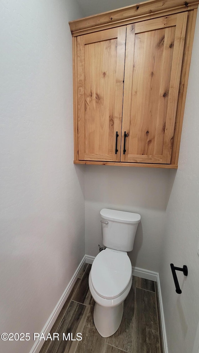 12880 E Brody Trl, Dewey-Humboldt, AZ 86327 - bathroom featuring baseboards, wood finished floors, and toilet