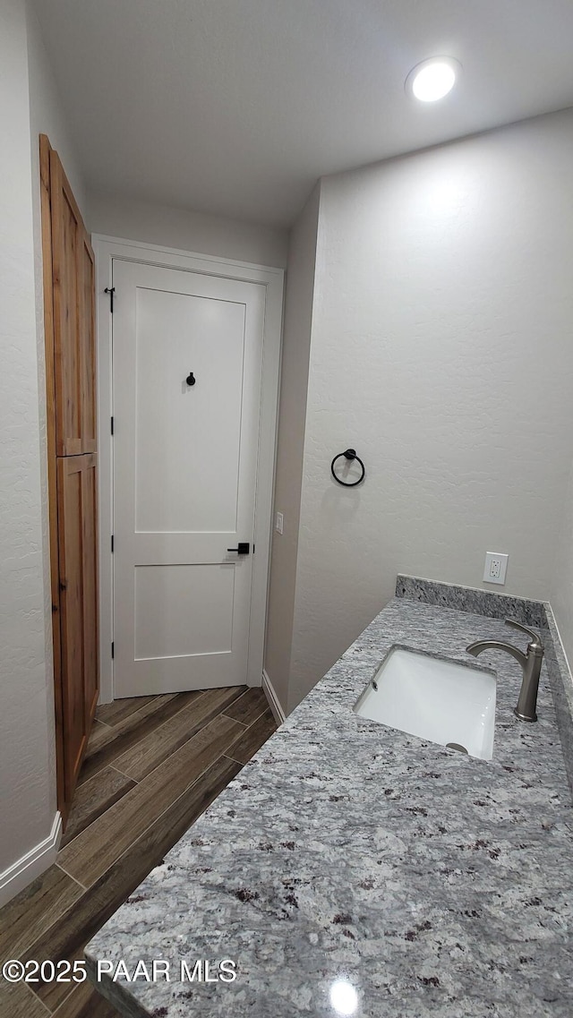 12880 E Brody Trl, Dewey-Humboldt, AZ 86327 - bathroom with wood finished floors, a sink, and baseboards