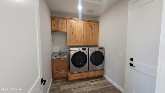 12880 E Brody Trl, Dewey-Humboldt, AZ 86327 - washroom with cabinet space, washer and dryer, light wood-style flooring, and baseboards