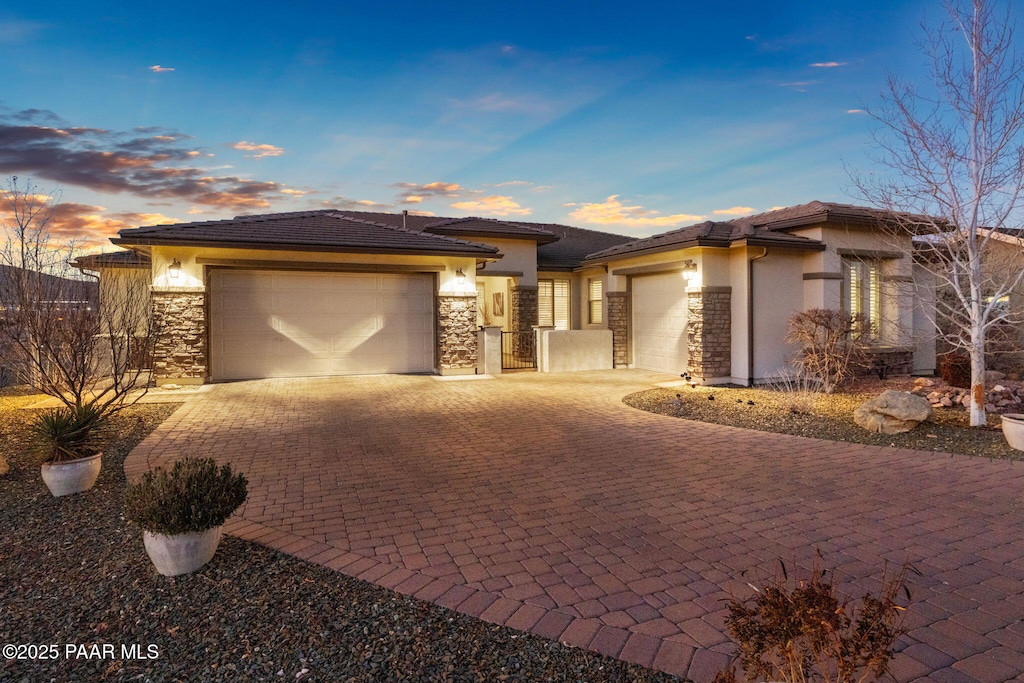 prairie-style house featuring a garage