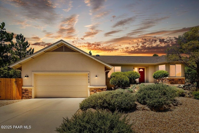 1520 Majestic Way, Prescott, AZ 86301 - single story home featuring stone siding, concrete driveway, stucco siding, and a garage