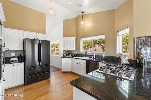 1520 Majestic Way, Prescott, AZ 86301 - kitchen featuring freestanding refrigerator, dishwasher, high vaulted ceiling, stainless steel gas stovetop, and a sink