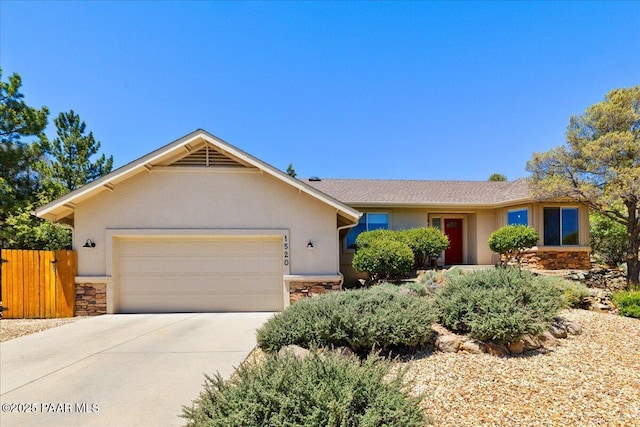 1520 Majestic Way, Prescott, AZ 86301 - ranch-style home featuring stone siding, stucco siding, a garage, and concrete driveway