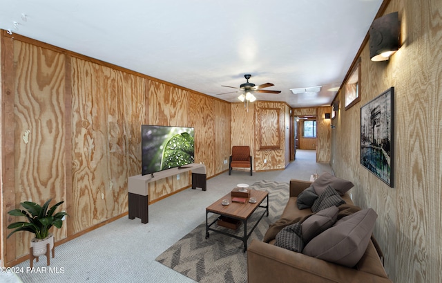 10190 N Prescott Ridge Rd, Prescott Valley, AZ 86315 - carpeted living room featuring ceiling fan and wood walls