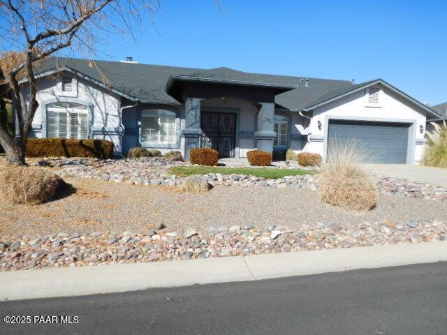 single story home with a garage