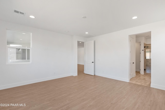 spare room with light hardwood / wood-style flooring