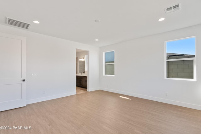 spare room with light wood-type flooring