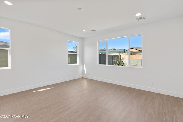 unfurnished room featuring light hardwood / wood-style flooring