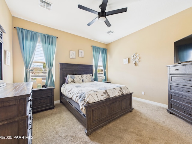 bedroom with light colored carpet, baseboards, and visible vents