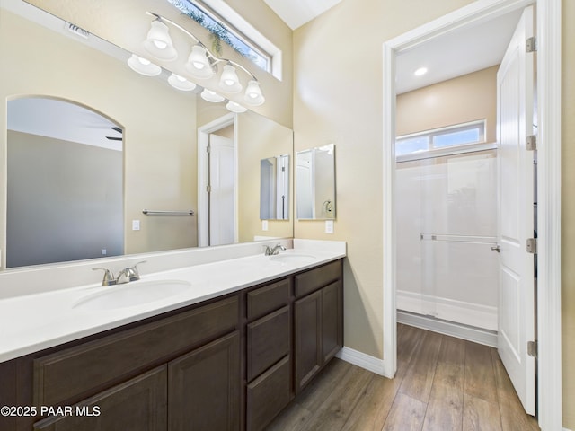 6331 E Marley Ave, Prescott Valley, AZ 86314 - full bath featuring wood finished floors, double vanity, baseboards, and healthy amount of natural light