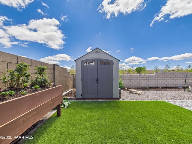 view of shed with a fenced backyard