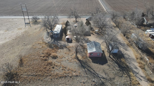 birds eye view of property with a rural view