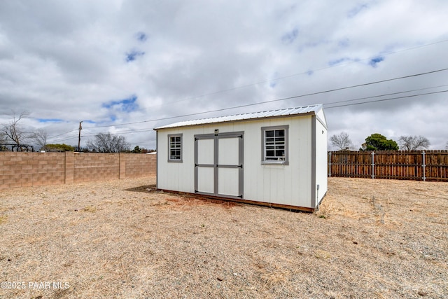 view of shed featuring a fenced backyard