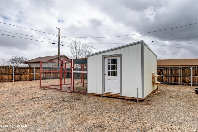 view of poultry coop featuring a fenced backyard