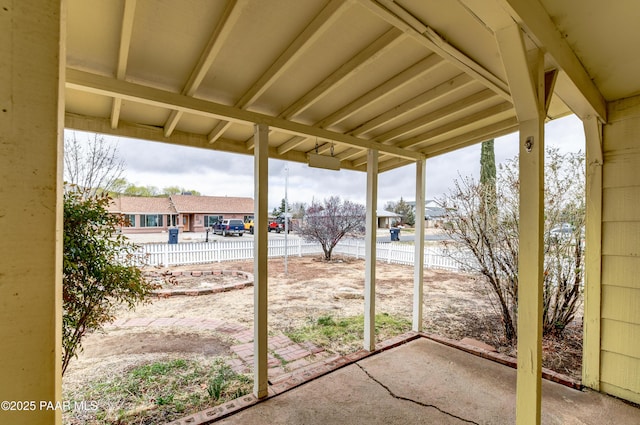 view of patio featuring fence