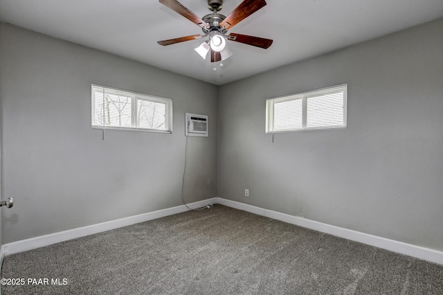 empty room with plenty of natural light, baseboards, and carpet floors