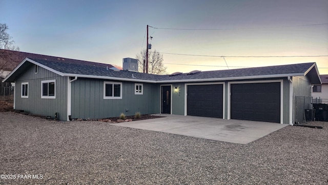 single story home with a garage and central AC