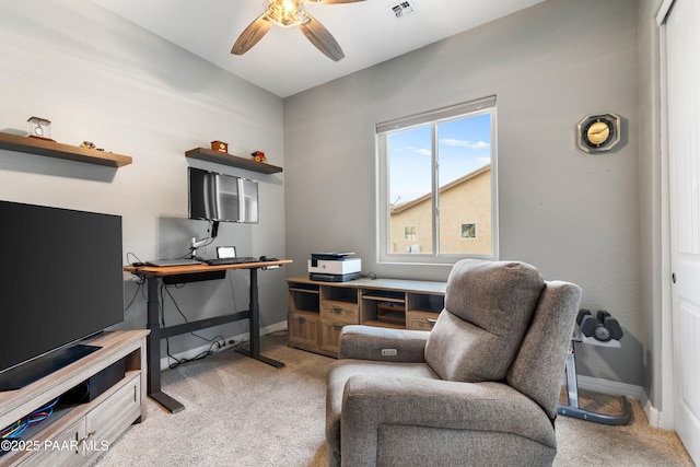 office space featuring ceiling fan and light carpet