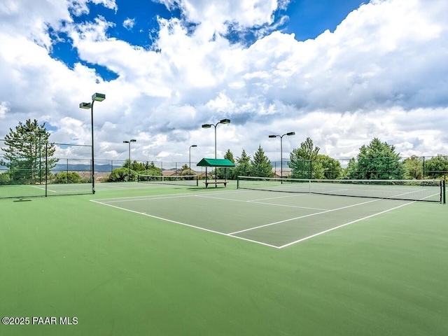 view of sport court with basketball hoop