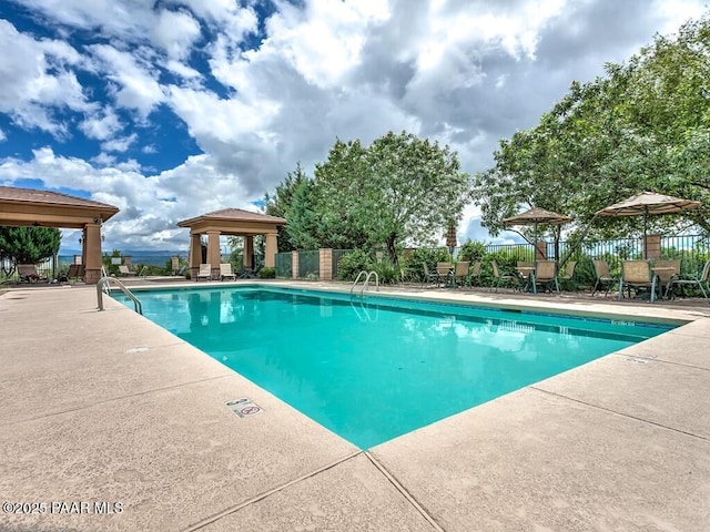 view of swimming pool featuring a gazebo and a patio area