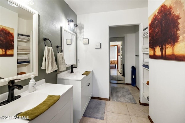 bathroom with tile patterned floors and vanity