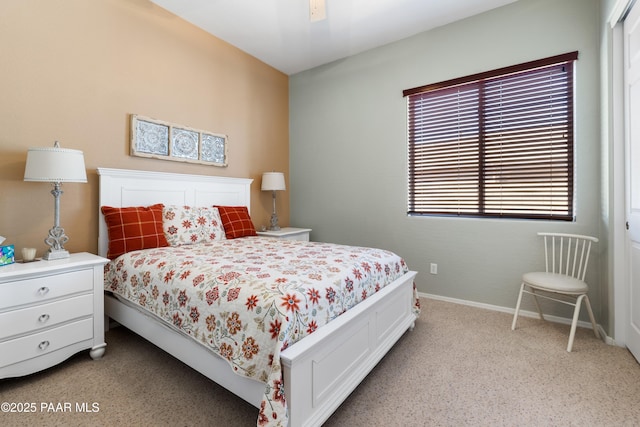 bedroom featuring a closet, a ceiling fan, baseboards, and light carpet