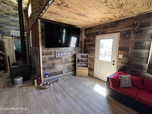 47 N Humble Ln, Ash Fork, AZ 86320 - living area with wood walls, wood finished floors, wooden ceiling, and a barn door