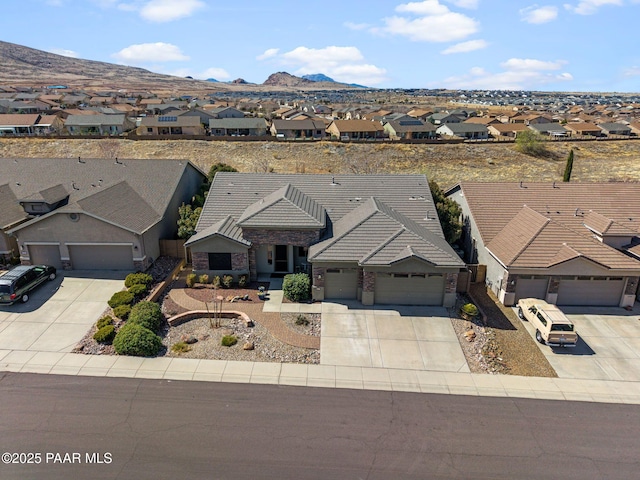 aerial view featuring a mountain view and a residential view