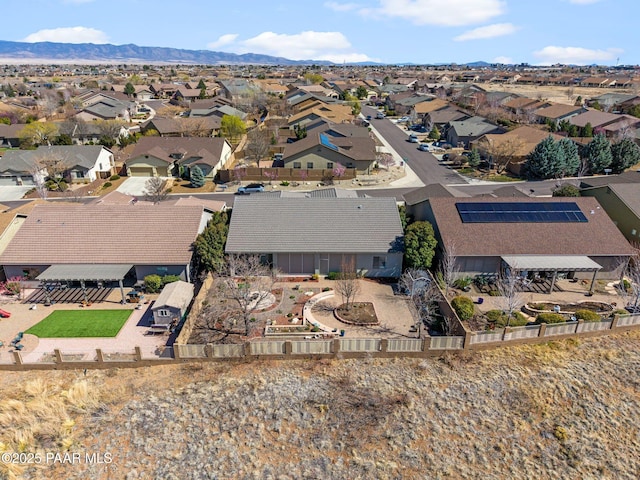 drone / aerial view featuring a residential view and a mountain view