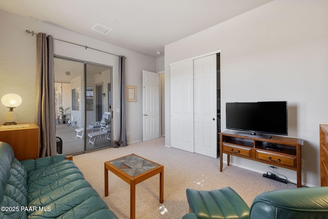 living room with visible vents and carpet flooring