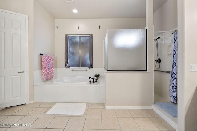 bathroom featuring tile patterned flooring, curtained shower, and a garden tub