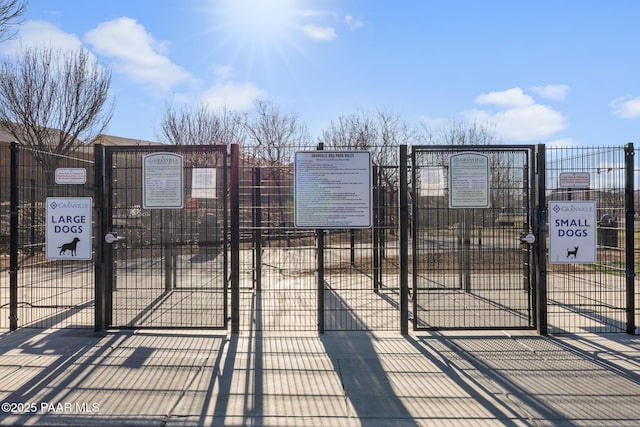 view of gate with fence