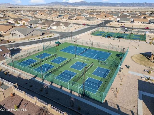 birds eye view of property with a mountain view and a residential view