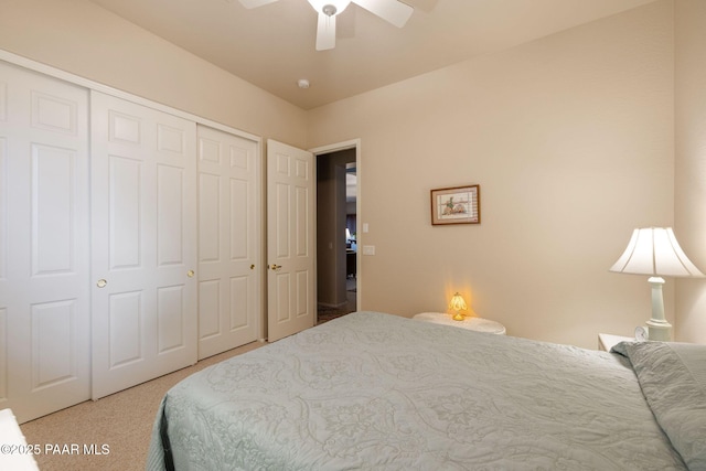 bedroom with a closet, carpet flooring, and ceiling fan