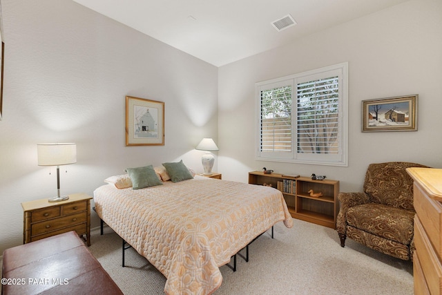 bedroom featuring visible vents and carpet flooring