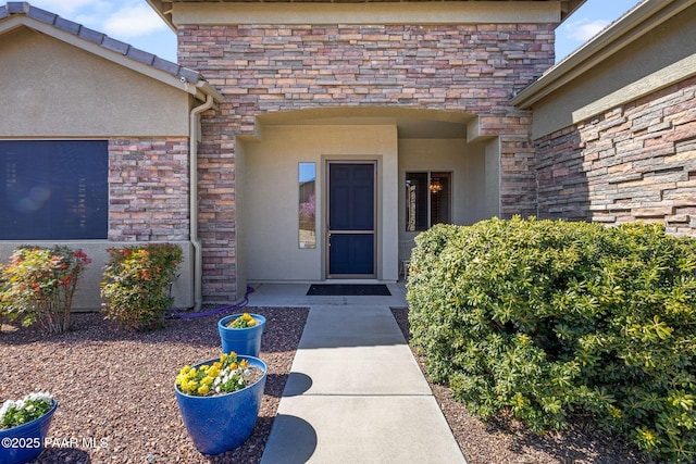 property entrance featuring stucco siding