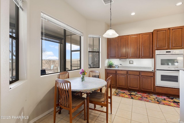 dining area featuring light tile patterned floors, visible vents, baseboards, and recessed lighting